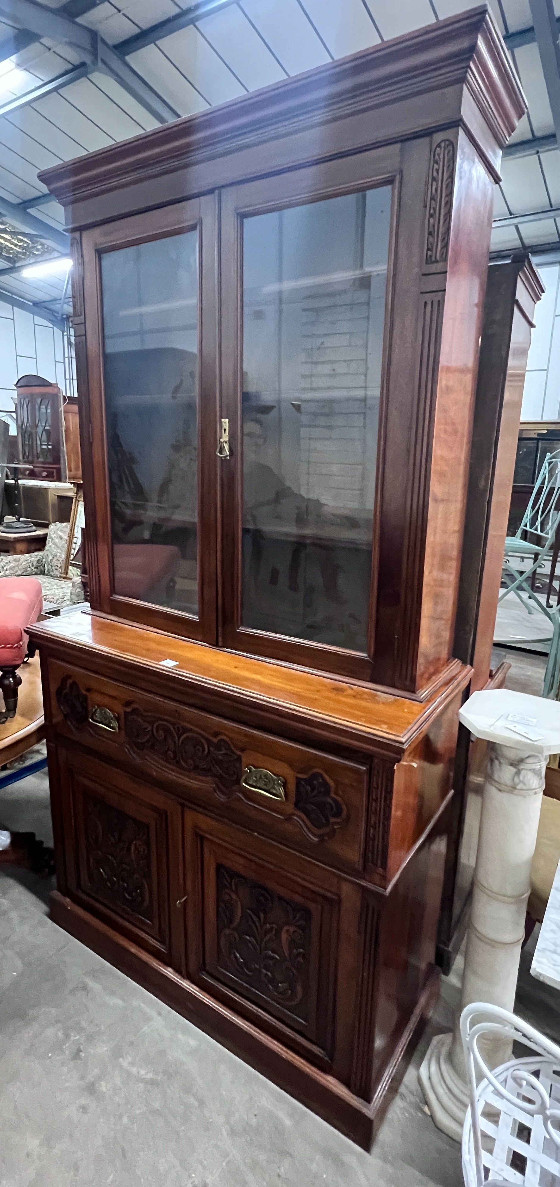 A late Victorian carved walnut secretaire bookcase, width 123cm, depth 48cm, height 234cm